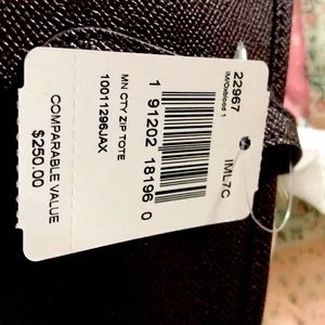 Coach bag. Brand new. Tags still on. Never used. Zipper closure. 12”x8”.